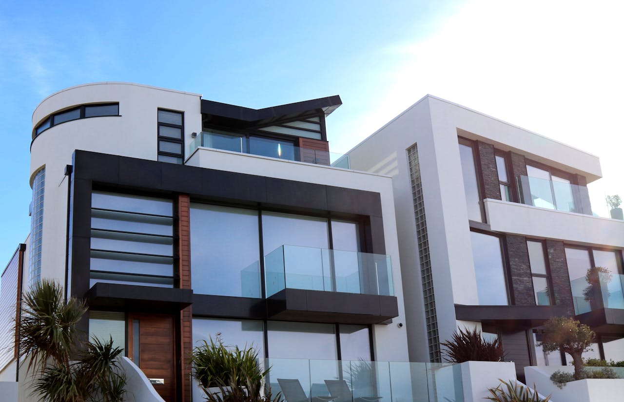 gallery-5 Contemporary luxury home with glass balconies in Poole, UK, showcasing modern architectural design.