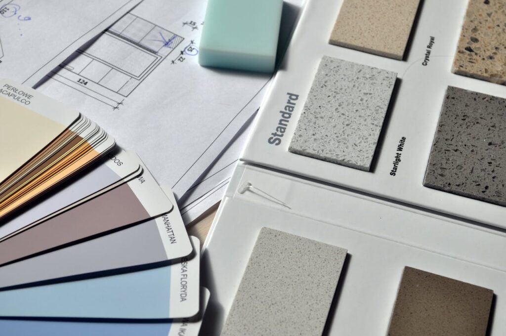 the interior of the repair interior design 159045 Color palette and material samples for interior renovation projects on a blueprint.